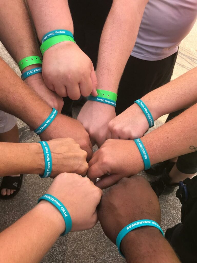 Hands in all wearing care bands